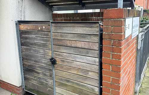 P and F Cladding - doors - bin store - before